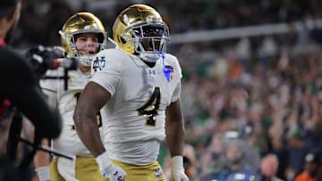 Jan 9, 2025; Miami, FL, USA; Notre Dame Fighting Irish running back Jeremiyah Love (4) celebrates a touch down in the second half against the Penn State Nittany Lions in the Orange Bowl at Hard Rock Stadium.