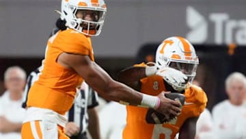 Tennessee quarterback Nico Iamaleava (8) fakes a handoff to running back Dylan Sampson (6) during the NCAA college football game against Kent State on Saturday, September 14, 2024, in Knoxville, Tenn.