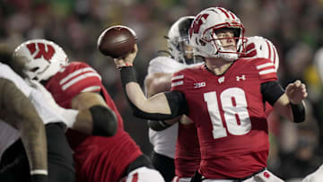 Wisconsin quarterback Braedyn Locke (18) throws during the first quarter of their game against Oregon Saturday, November 16, 2024 at Camp Randall Stadium in Madison, Wisconsin.