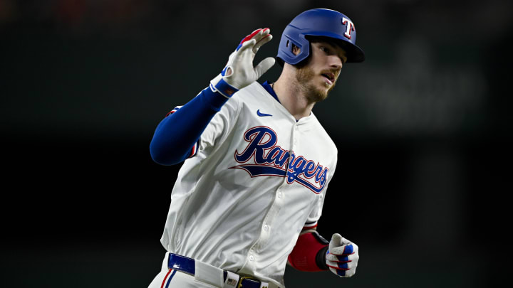 Aug 3, 2024; Arlington, Texas, USA;  Texas Rangers catcher Jonah Heim (28) rounds the bases after he hits a three run home run against the Boston Red Sox during the fourth inning at Globe Life Field. Mandatory Credit: Jerome Miron-USA TODAY Sports