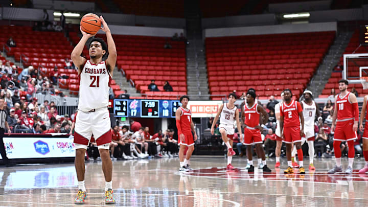 Oct 25, 2025; Pullman, WA, USA; Washington State Cougars guard Ace Glass Lll (21) shoots a technical foul against the New Mexico Lobos in the first half at Friel Court at Beasley Coliseum. Mandatory Credit: James Snook-Imagn Images