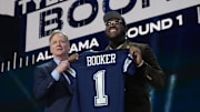 NFL commissioner Roger Goodell with Alabama Crimson Tide offensive lineman Tyler Booker after he is selected by the Dallas Cowboys as the number twelve pick in the first round of the 2025 NFL Draft at Lambeau Field. 