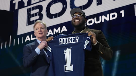 Apr 24, 2025; Green Bay, WI, USA; NFL commissioner Roger Goodell with Alabama Crimson Tide offensive lineman Tyler Booker after the Dallas Cowboys selects him as the number twelve pick in the first round of the 2025 NFL Draft at Lambeau Field. 