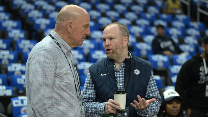 Apr 21, 2024; Los Angeles, California, USA; Los Angeles Clippers owner Steve Ballmer, left, talks with Lawrence Frank, President of Basketball Operations, prior to game one of the first round for the 2024 NBA playoffs against the Dallas Mavericks at Crypto.com Arena. 