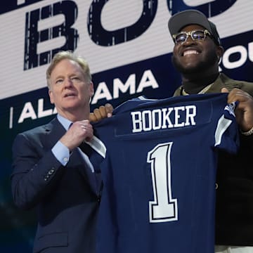 NFL commissioner Roger Goodell with Alabama Crimson Tide offensive lineman Tyler Booker after he is selected by the Dallas Cowboys