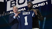 NFL commissioner Roger Goodell with Alabama star Tyler Booker after being chosen by the Dallas Cowboys at the 2025 NFL Draft