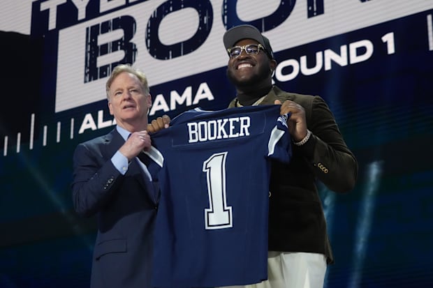 NFL commissioner Roger Goodell with Alabama offensive lineman Tyler Booker after he was drafted by the Dallas Cowboys. 