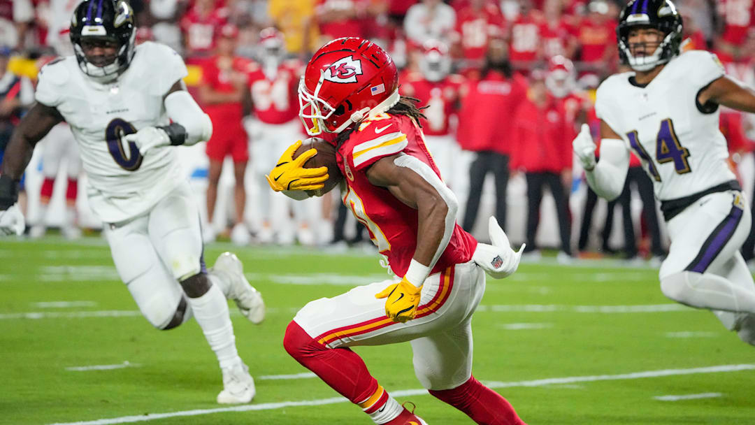 Sep 5, 2024; Kansas City, Missouri, USA; Kansas City Chiefs running back Isiah Pacheco (10) runs the ball as Baltimore Ravens linebacker Roquan Smith (0) chases during the first half at GEHA Field at Arrowhead Stadium. Mandatory Credit: Denny Medley-Imagn Images