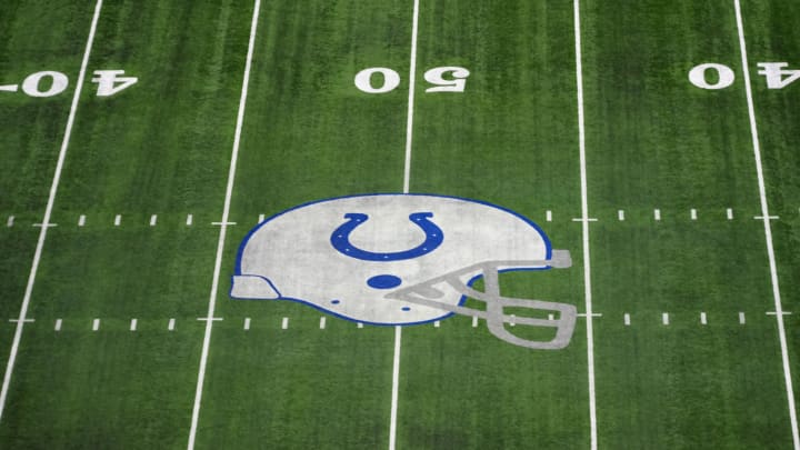 The Indianapolis Colts helmet logo at midfield of Lucas Oil Stadium.