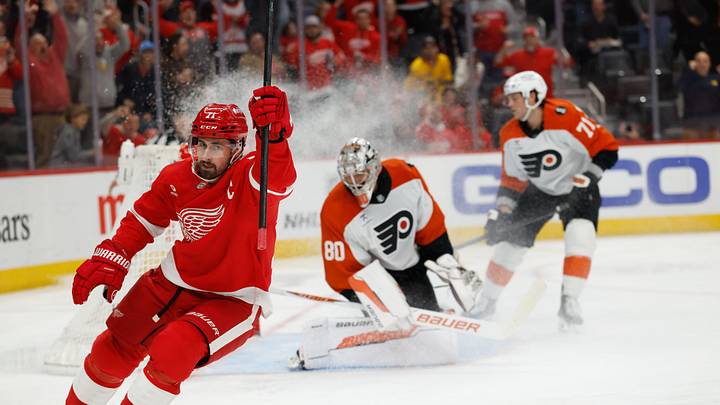 Mar 28, 2026; Detroit, Michigan, USA;  Detroit Red Wings center Dylan Larkin (71) celebrates after scoring on Philadelphia Flyers goaltender Dan Vladar (80) in the second period at Little Caesars Arena. Mandatory Credit: Rick Osentoski-Imagn Images