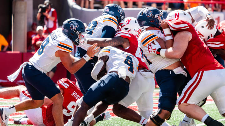 Aug 31, 2024; Lincoln, Nebraska, USA; UTEP Miners running back Jevon Jackson (4) is tackled for a safety by the Nebraska Cornhuskers during the second quarter at Memorial Stadium.