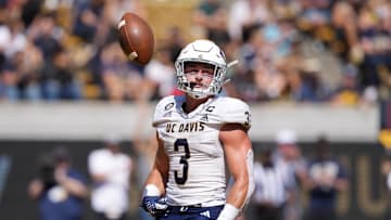 Aug 31, 2024; Berkeley, California, USA; UC Davis Aggies running back Lan Larison (3) flips the ball into the air after scoring a touchdown against the California Golden Bears during the second quarter at California Memorial Stadium. Mandatory Credit: Darren Yamashita-Imagn Images