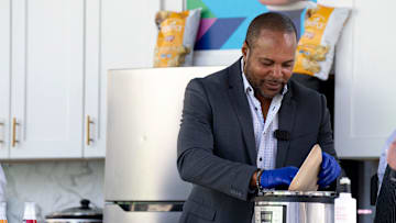 Barry Larkin, former Cincinnati Reds player, helps cook a meal during the Kroger Wellness Festival presented by Pepsico in Cincinnati on Friday, Sept. 23, 2022.