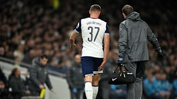 Micky van de Ven walking off whilst feeling his hamstring 