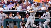 Jun 22, 2024; Omaha, NE, USA; Texas A&M Aggies left fielder Caden Sorrell (13) hits a RBI single against the Tennessee Volunteers during the first inning at Charles Schwab Field Omaha. Mandatory Credit: Dylan Widger-Imagn Images