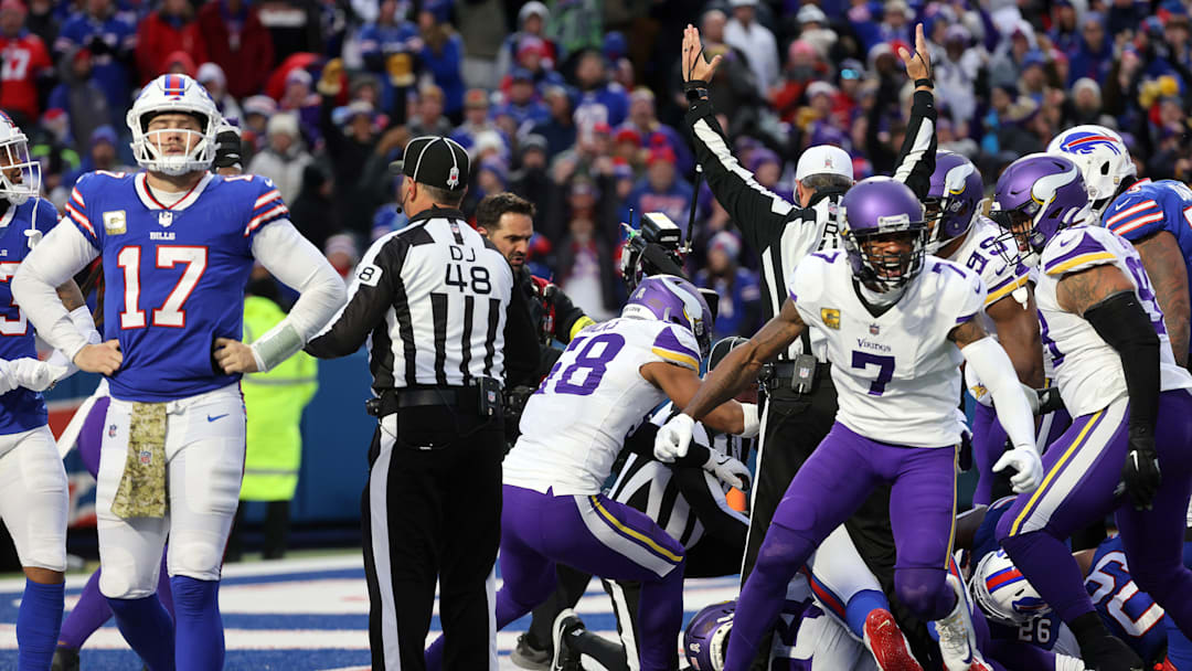 Vikings Patrick Peterson celebrates as Bills quarterback Josh Allen walks off the field.  Minnesota scored when Allen didn   t handle the snap at the goal line and the Vikings recovered the ball in the end zone.