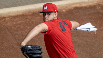 Feb 18, 2025; Lee County, FL, USA; Minnesota Twins pitcher Eiberson Castellano (63) warming up in the bullpen during spring training at the Lee Health Sports Complex.