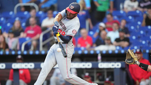 Washington Nationals designated hitter James Wood (29) hits a double