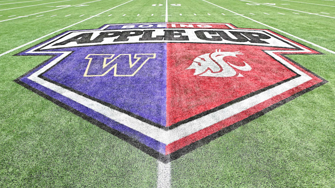 The midfield logo for the 2024 Apple Cup, which was held at Seattle's Lumen Field due to renovations at Husky Stadium, portrays the logos and colors of both the University of Washington (left) and Washington State University (right).