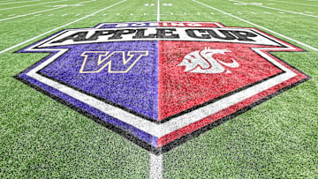 The midfield logo for the 2024 Apple Cup, which was held at Seattle's Lumen Field due to renovations at Husky Stadium, portrays the logos and colors of both the University of Washington (left) and Washington State University (right).