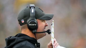 Oct 12, 2025; Green Bay, Wisconsin, USA; Cincinnati Bengals head coach Zac Taylor communicates from the sidelines during the second quarter against the Green Bay Packers at Lambeau Field. Mandatory Credit: Jeff Hanisch-Imagn Images