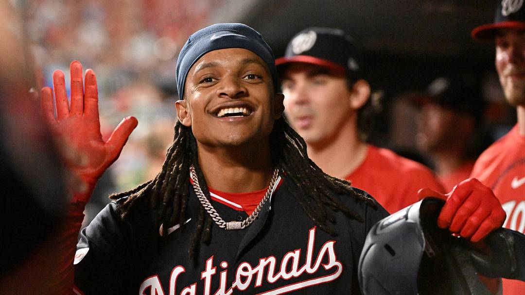 Sep 18, 2026; St. Louis, Missouri, USA;  Washington Nationals shortstop CJ Abrams (5) is congratulated by teammates after scoring against the St. Louis Cardinals during and joining the 30-30 club the first inning at Busch Stadium.  Mandatory Credit: Jeff Le-Imagn Images