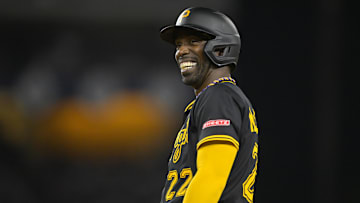Apr 25, 2025; Los Angeles, California, USA;  Pittsburgh Pirates designated hitter Andrew McCutchen (22) smiles after a single in the fifth inning against the Los Angeles Dodgers at Dodger Stadium. Mandatory Credit: Jayne Kamin-Oncea-Imagn Images