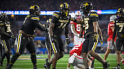 Dec 29, 2023; Arlington, TX, USA; Missouri Tigers linebacker Triston Newson (14) and defensive back Daylan Carnell (13) celebrate a defensive stop on the Ohio State Buckeyes during the second quarter at AT&T Stadium. Mandatory Credit: Jerome Miron-USA TODAY Sports
