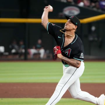 Aug 28, 2024; Phoenix, Arizona, USA; Arizona Diamondbacks pitcher Justin Martinez (63) pitches against the New York Mets during the ninth inning at Chase Field. Mandatory Credit: Joe Camporeale-USA TODAY Sports