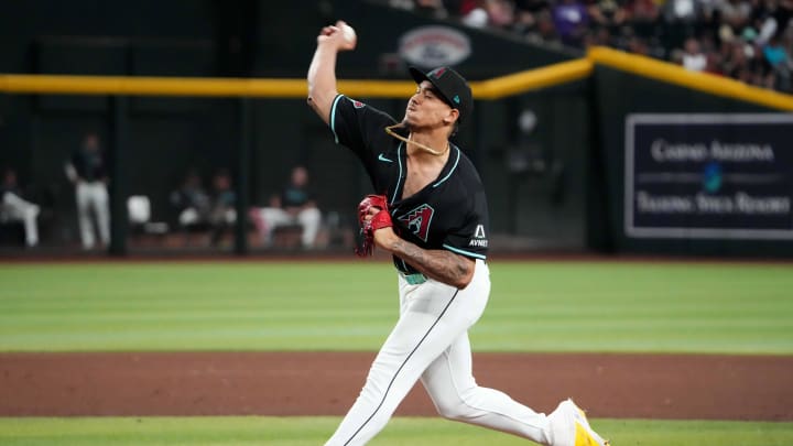 Aug 28, 2024; Phoenix, Arizona, USA; Arizona Diamondbacks pitcher Justin Martinez (63) pitches against the New York Mets during the ninth inning at Chase Field. Mandatory Credit: Joe Camporeale-USA TODAY Sports