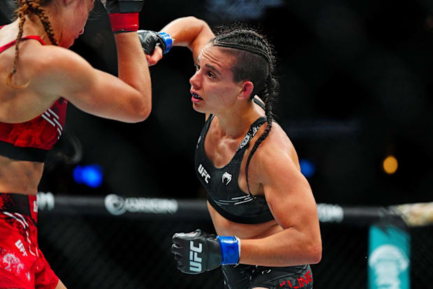Jasmine Jasudavicius (red gloves) fights Fatima Kline (blue gloves) during UFC Fight Night at Ball Arena. 
