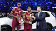 Feb 15, 2025; San Francisco, CA, USA; Team Cavs center Evan Mobley (4) and guard Donovan Mitchell (45) of the Cleveland Cavaliers celebrate with the trophies after winning the skills challenge during All Star Saturday Night ahead of the 2025 NBA All Star Game at Chase Center. Mandatory Credit: Kyle Terada-Imagn Images