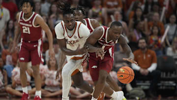 Feb 5, 2025; Austin, Texas, USA; Arkansas Razorbacks guard Johnell Davis (1) and Texas Longhorns forward Arthur Kaluma (6) battle for the loose ball during the second half at Moody Center. Mandatory Credit: Scott Wachter-Imagn Images