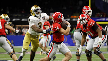 Jan 2, 2025; New Orleans, LA, USA; Georgia Bulldogs quarterback Gunner Stockton (14) runs with the ball during the second half against Notre Dame Fighting Irish running back Gi'Bran Payne (3) at Caesars Superdome. Mandatory Credit: Amber Searls-Imagn Images