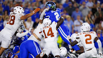 Oct 18, 2025; Lexington, Kentucky, USA; Kentucky Wildcats running back Dante Dowdell (2) attempts to score a touchdown but comes up short in overtime against the Texas Longhorns at Kroger Field. Mandatory Credit: Jordan Prather-Imagn Images