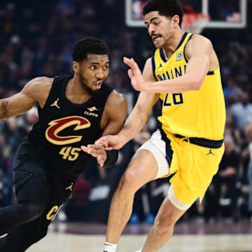 May 13, 2025; Cleveland, Ohio, USA; Cleveland Cavaliers guard Donovan Mitchell (45) drives to the basket against Indiana Pacers guard Ben Sheppard (26) during the first half of game five of the second round for the 2025 NBA Playoffs at Rocket Arena. Mandatory Credit: Ken Blaze-Imagn Images