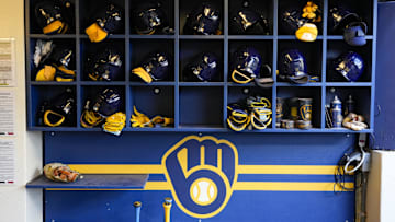 Sep 17, 2024; Milwaukee, Wisconsin, USA;  General view of batting helmets inside the Milwaukee Brewers dugout prior to the game against the Philadelphia Phillies at American Family Field. Mandatory Credit: Jeff Hanisch-Imagn Images
