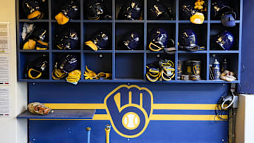 Sep 17, 2024; Milwaukee, Wisconsin, USA;  General view of batting helmets inside the Milwaukee Brewers dugout prior to the game against the Philadelphia Phillies at American Family Field. Mandatory Credit: Jeff Hanisch-Imagn Images