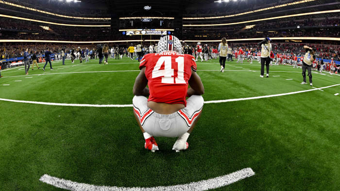Dec 29, 2023; Arlington, TX, USA; Ohio State Buckeyes safety Josh Proctor (41) watches the Missouri