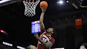 Jan 21, 2025; Charlottesville, Virginia, USA; Boston College Eagles forward Chad Venning (32) shoots the ball over Virginia Cavaliers guard Dai Dai Ames (7) during the first half at John Paul Jones Arena. Mandatory Credit: Amber Searls-Imagn Images