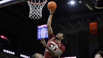 Jan 21, 2025; Charlottesville, Virginia, USA; Boston College Eagles forward Chad Venning (32) shoots the ball over Virginia Cavaliers guard Dai Dai Ames (7) during the first half at John Paul Jones Arena. Mandatory Credit: Amber Searls-Imagn Images