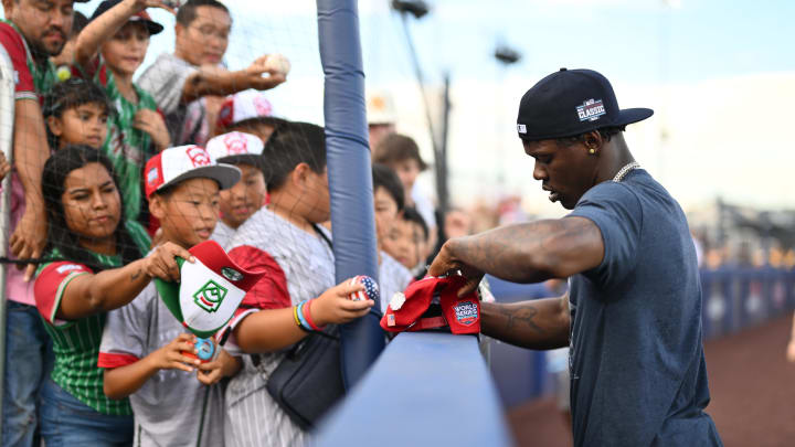 New York Yankees infielder Jazz Chisholm Jr. (13) signs autographs before the game against the Detroit Tigers at the Ballpark at Historic Bowman Field on Aug 18.