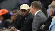 May 16, 2025; San Francisco, California, USA; Golden State Warriors forward Jonathan Kuminga (center left) talks with owner Joe Lacob (center right) during the second quarter of the game between the Golden State Valkyries and the Los Angeles Sparks at Chase Center. Mandatory Credit: Darren Yamashita-Imagn Images