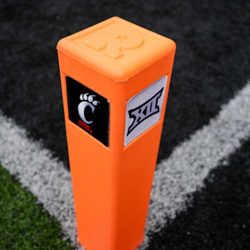 Oct 14, 2023; Cincinnati, Ohio, USA;  A view of the Cincinnati and Big XII logo on an end zone pylon before a game between the Iowa State Cyclones and the Cincinnati Bearcats at Nippert Stadium. Mandatory Credit: Aaron Doster-Imagn Images