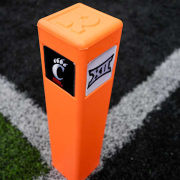 Oct 14, 2023; Cincinnati, Ohio, USA;  A view of the Cincinnati and Big XII logo on an end zone pylon before a game between the Iowa State Cyclones and the Cincinnati Bearcats at Nippert Stadium. Mandatory Credit: Aaron Doster-Imagn Images