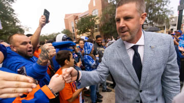 Florida Gators head coach Billy Napier gives fist bumps to fans during Gator Walk at Ben Hill Griffin Stadium in Gainesville, FL on Saturday, November 25, 2023 befoe the game against the Florida State Seminoles. [Doug Engle/Gainesville Sun]