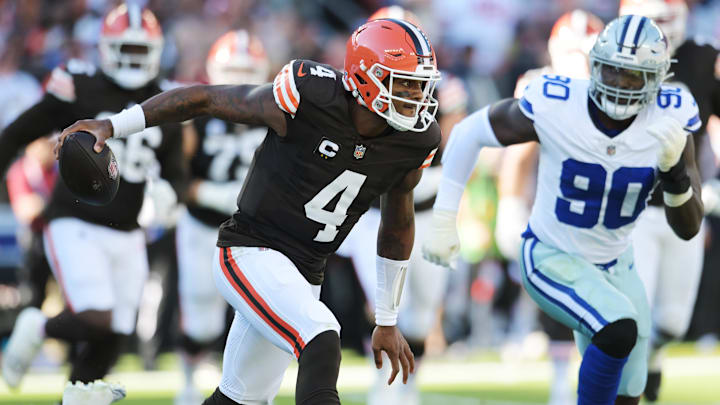 Browns quarterback Deshaun Watson (4) runs from Dallas Cowboys defensive end DeMarcus Lawrence