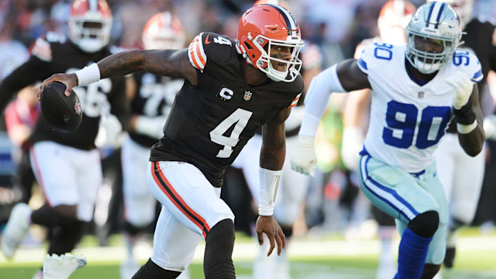 Sep 8, 2024; Cleveland, Ohio, USA; Cleveland Browns quarterback Deshaun Watson (4) runs from Dallas Cowboys linebacker Micah Parsons (11) and defensive end DeMarcus Lawrence (90) during the first quarter at Huntington Bank Field.