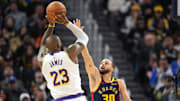 Jan 25, 2025; San Francisco, California, USA; Golden State Warriors guard Stephen Curry (30) defends against Los Angeles Lakers forward LeBron James (23) during the fourth quarter at Chase Center. Mandatory Credit: Darren Yamashita-Imagn Images