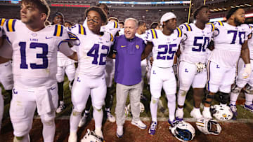 Oct 19, 2024; Fayetteville, Arkansas, USA; LSU Tigers quarterback Garrett Nussmeier (13), along with teammates and head coach Brian Kelly sing the LSU alma mater after a game.